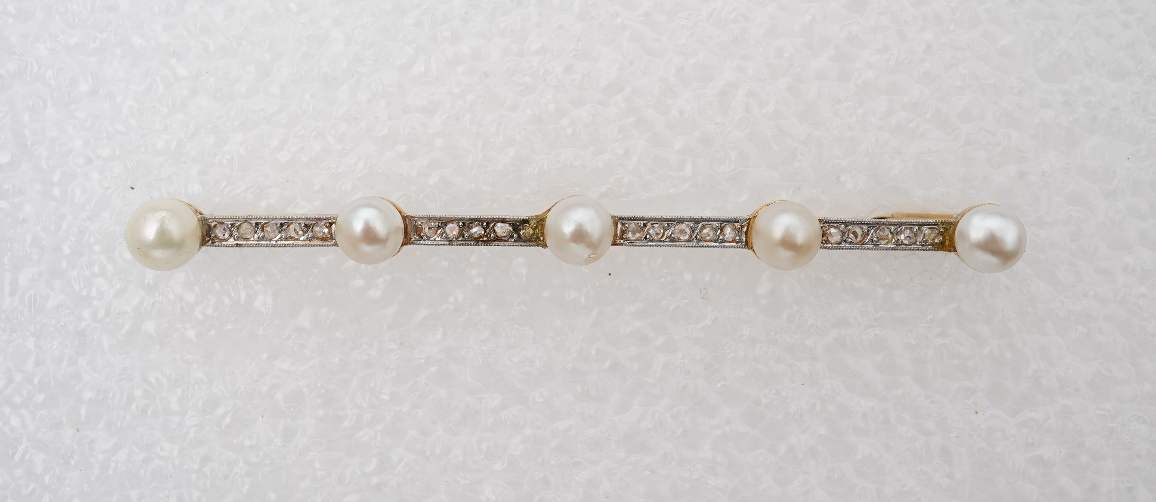 A pearl and diamond bar brooch, France, early 20th century